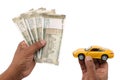 Indian currency notes and toy car in the hands bank loan concept Royalty Free Stock Photo