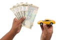 Indian currency notes and toy car in the hands bank loan concept Royalty Free Stock Photo