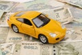 Indian currency notes and toy car in the hands bank loan concept Royalty Free Stock Photo