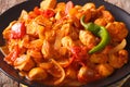 Indian curry Chicken Jalfrezi with spices, tomato sauce and caps