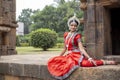 Indian Dance. Indian folk dance Odissi. Dancer posing at ancient temple wearing traditional costume. Royalty Free Stock Photo