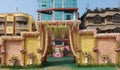 Indian decoration of flower gate with green carpet, idol of lord Ganesh ready for a reception party