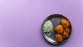 Indian delicious mysore bonda with chutney for a healthy evening snack Royalty Free Stock Photo