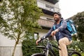 indian delivery man with bag riding bicycle Royalty Free Stock Photo