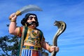 Indian demon statue with snake Royalty Free Stock Photo