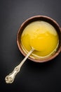 Indian or desi ghee or pure ghee served in a wooden bowl Royalty Free Stock Photo