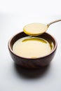 Indian or desi ghee or pure ghee served in a wooden bowl