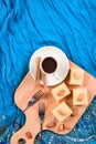 Indian dessert halava with almonds served with coffee on indigo Royalty Free Stock Photo