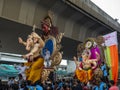 Indian devotees carry a huge idol of the elephant headed Hindu God Lord Ganesha in chinchpokali Lalbag Mumbai