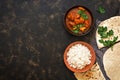 Indian dish Chicken Tikka masala with rice. Top view, copy space.