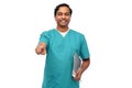 indian doctor with folder pointing finger to you Royalty Free Stock Photo