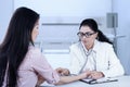 Indian doctor listening the patient heartbeat Royalty Free Stock Photo