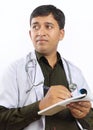 Indian Doctor Writing Prescription Royalty Free Stock Photo