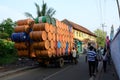 Indian drivers preparing heavily overloaded truck for travelling at Kerala