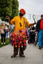 indian drummer playing traditional dhol instrument in the street. Fest day of india in Moscow