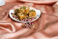 Indian dry fruits and fig sweets in a white plate