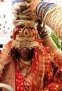 Indian dulhan have taken pooja kalash at head Royalty Free Stock Photo