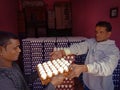 an indian egg seller giving egg to the customer at meat shop in india dec 2019 Royalty Free Stock Photo