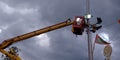 indian electricity board repairing street lights on sky background in india dec 2019