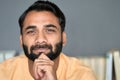 Indian ethnic bearded man looking at camera at home indoors. Close up portrait. Royalty Free Stock Photo
