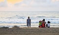 Indian family catch sunrise at beach