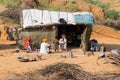 Indian family near straw hut in Pushkar, India Royalty Free Stock Photo