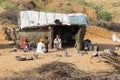 Indian family near straw hut in Pushkar, India Royalty Free Stock Photo