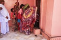 Indian family offering food for rats, Karni Mata Temple, Deshnok, India