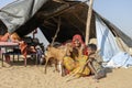 Indian family outdoors in desert on time Pushkar Camel Mela, Rajasthan, India Royalty Free Stock Photo