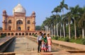 Indian family standing in front of Tomb of Safdarjung in New Del Royalty Free Stock Photo