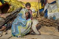 Indian family on the street. Poor people come with family to the city from the village for work. And they living in the street in