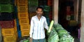 An indian farmer catching vegetable like samurai at agriculture store