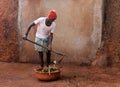 Indian farmer collecting cow dung