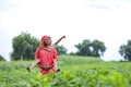 Indian farmer playing with his child at green field