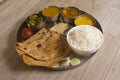 Indian Fasting cuisine Upwas items Thali complere meal for vrat ekadashi.Upawas thali meal with Rajgira puri, paratha,shakarkand