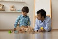 Indian father play toys with small son