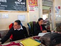 indian female advocate working on office table with male staff at supreme Supreme Court in India January 2020