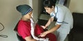 An indian female nurse staff checking breath of pregnancy patient