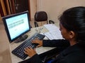 An indian female office incharge working on personal computer in India January 2020