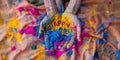 Indian festival of colors. Hands cupped together holding vibrant Holi powder with \