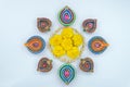 Indian festival Diwali, Diya oil lamps lit on colorful rangoli. Hindu traditional. Happy Deepavali. Copy space for text Royalty Free Stock Photo