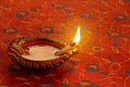 Indian Festival Diwali Diya Lamp Light on Red background