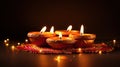 Indian festival Diwali, Diya oil lamps lit on colorful rangoli Generative AI Royalty Free Stock Photo