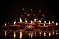 Indian festival Diwali, Diya oil lamps lit on colorful rangoli. Hindu traditional. Copy space for text, Diwali festival of lights Royalty Free Stock Photo