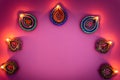 Indian festival Diwali, Diya oil lamps lit on colorful rangoli. Hindu traditional. Happy Deepavali. Copy space for text Royalty Free Stock Photo