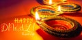 Indian festival Diwali, Diya oil lamps lit on colorful rangoli. Hindu traditional. Happy Deepavali. Copy space for text Royalty Free Stock Photo