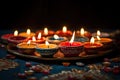 Indian festival Diwali, Diya oil lamps lit on colorful rangoli. Hindu traditional. Selective focus, Diwali festival of lights Royalty Free Stock Photo