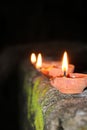  Diwali. Festival of light. three lamp line on the wall with blurred background. Indian winter season festival.