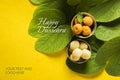 Indian festival dussehra, showing golden leaf with traditional indian sweets pedha in silver bowl on yellow background, greeting c