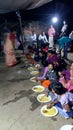 Indian festival and the man`s are eat hotchpotch.